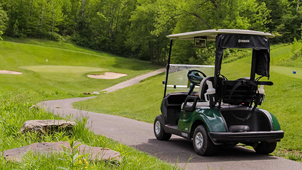 Golf cart on a winding Holiday Valley course path